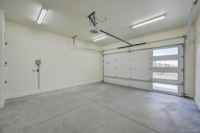 717 Marquette Ave, Buena Vista, CO 81211 - garage featuring a garage door opener and baseboards