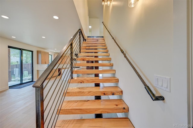 717 Marquette Ave, Buena Vista, CO 81211 - stairs featuring recessed lighting and wood finished floors