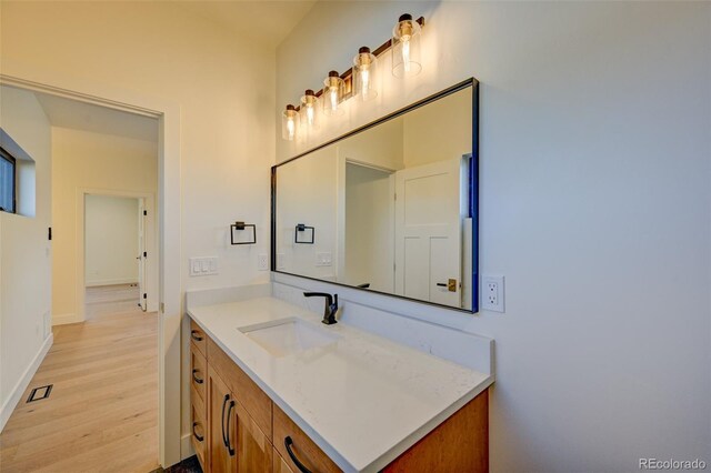 717 Marquette Ave, Buena Vista, CO 81211 - bathroom featuring wood finished floors and vanity