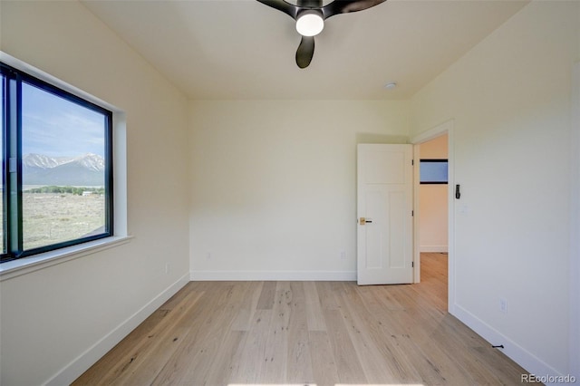 717 Marquette Ave, Buena Vista, CO 81211 - unfurnished room with light wood-type flooring, ceiling fan, and a smoke detector