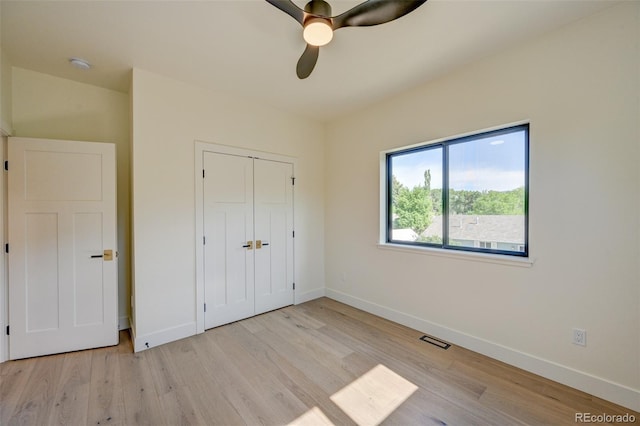 717 Marquette Ave, Buena Vista, CO 81211 - unfurnished bedroom with wood finished floors, a closet, and ceiling fan