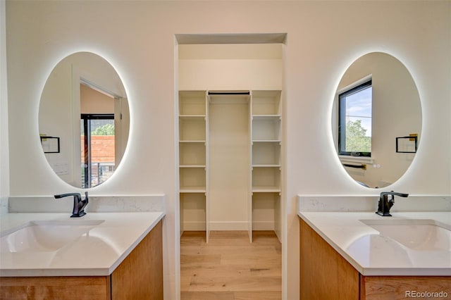 717 Marquette Ave, Buena Vista, CO 81211 - bathroom featuring vanity, plenty of natural light, and wood finished floors
