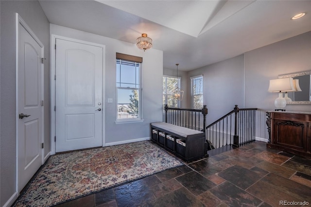 foyer entrance featuring a chandelier