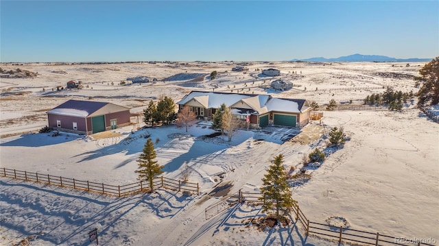 birds eye view of property featuring a mountain view