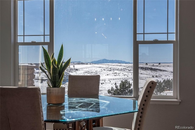 unfurnished dining area with a mountain view