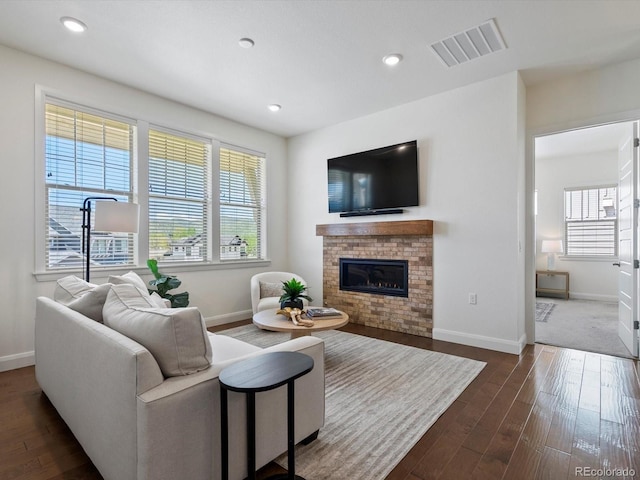 10258 W Coal Mine Pl, Littleton, CO 80127 - living room with baseboards, dark wood-type flooring, a fireplace, and recessed lighting