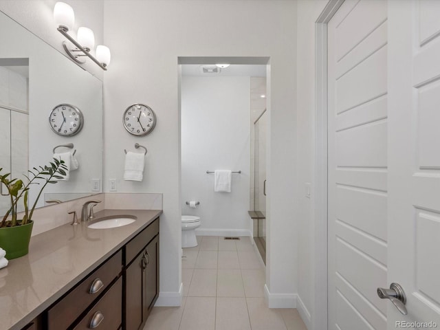 10258 W Coal Mine Pl, Littleton, CO 80127 - full bathroom with a shower stall, baseboards, tile patterned floors, toilet, and vanity