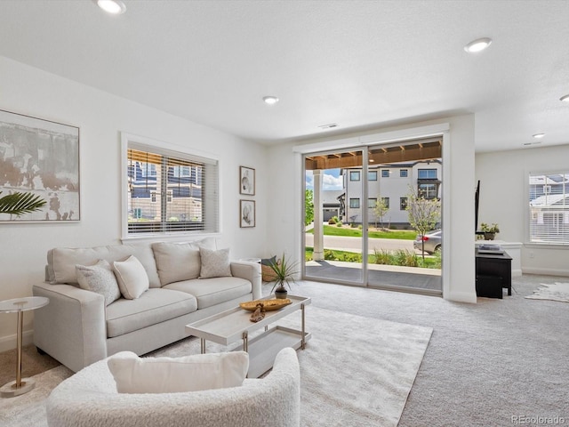 10258 W Coal Mine Pl, Littleton, CO 80127 - living room with carpet floors, baseboards, and recessed lighting