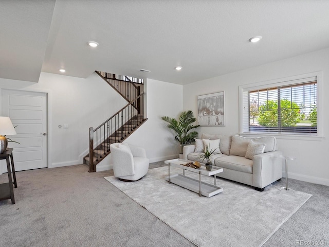 10258 W Coal Mine Pl, Littleton, CO 80127 - living area featuring carpet floors, stairs, baseboards, and recessed lighting