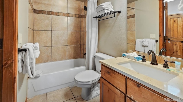 full bathroom with shower / tub combo with curtain, vanity, tile patterned floors, and toilet