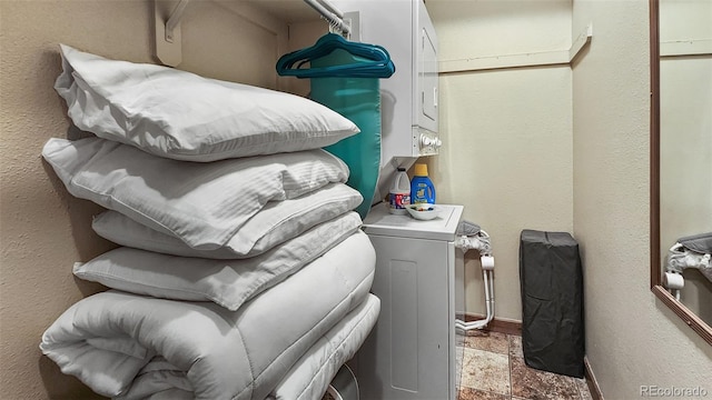 washroom with stacked washer / dryer