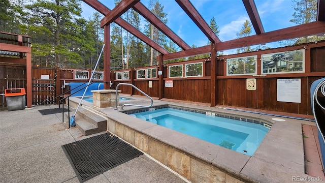 view of swimming pool featuring an indoor in ground hot tub