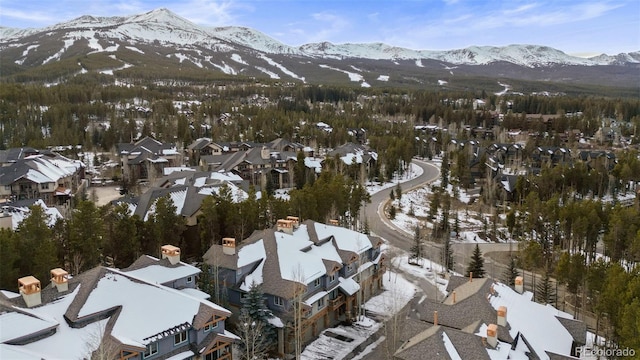 snowy aerial view with a mountain view