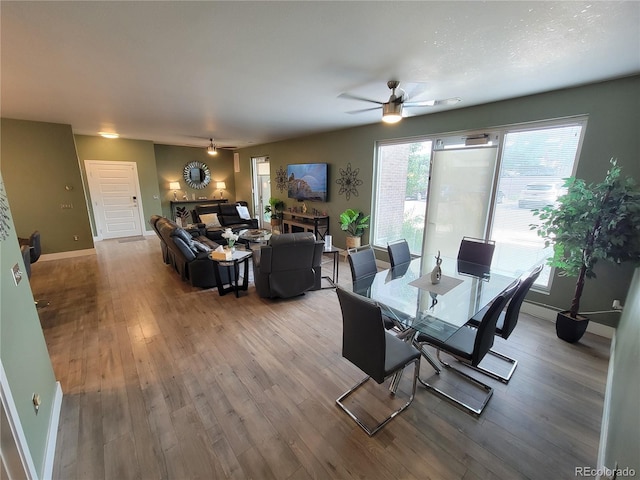 15354 W 64th Ln Unit 108, Arvada, CO 80007 - dining room featuring a ceiling fan and wood finished floors