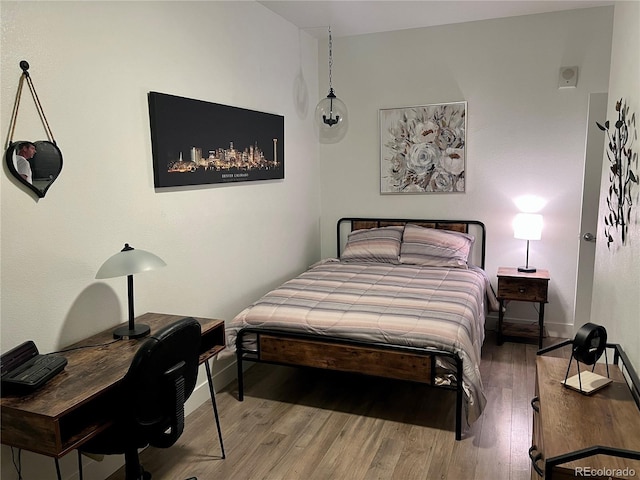 15354 W 64th Ln Unit 108, Arvada, CO 80007 - bedroom with wood finished floors and baseboards