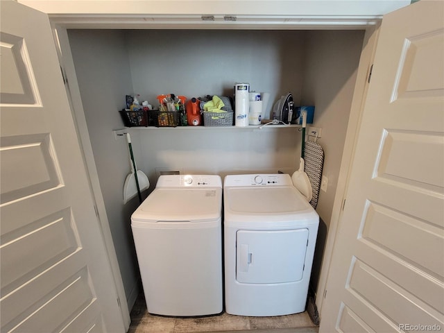 15354 W 64th Ln Unit 108, Arvada, CO 80007 - laundry room with independent washer and dryer and light tile patterned floors
