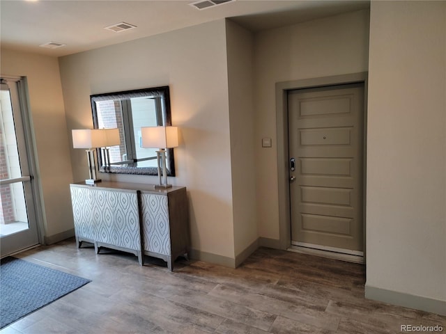 15354 W 64th Ln Unit 108, Arvada, CO 80007 - foyer entrance featuring wood finished floors and baseboards