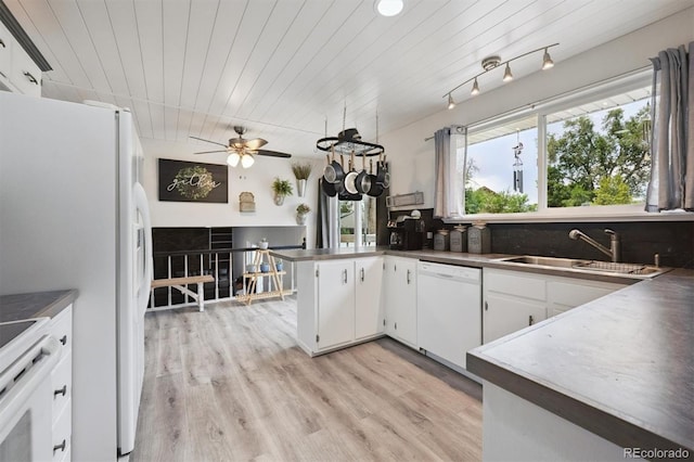 6455 Field St, Arvada, CO 80004 - kitchen with white appliances, backsplash, white cabinets, a ceiling fan, and light wood finished floors
