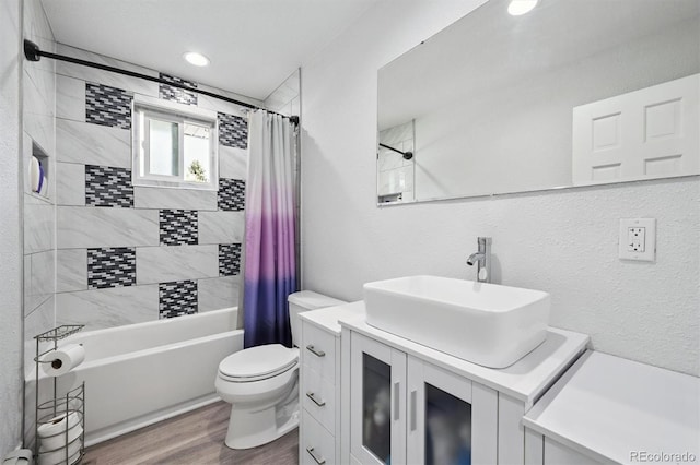 6455 Field St, Arvada, CO 80004 - bathroom featuring shower / tub combo, vanity, and wood finished floors