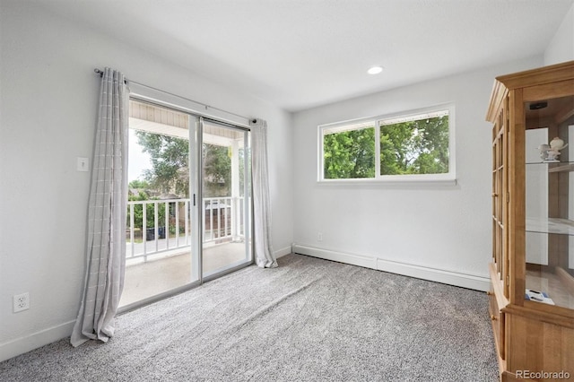 6455 Field St, Arvada, CO 80004 - empty room featuring a baseboard heating unit and carpet flooring