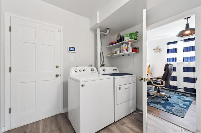 6455 Field St, Arvada, CO 80004 - laundry room featuring washer and clothes dryer, light wood finished floors, and a desk