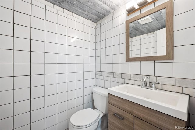 6455 Field St, Arvada, CO 80004 - half bath featuring vanity and tile walls