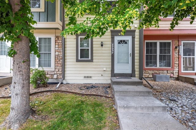 2933 W 81st Ave Unit F, Westminster, CO 80031 - property entrance featuring stone siding and crawl space