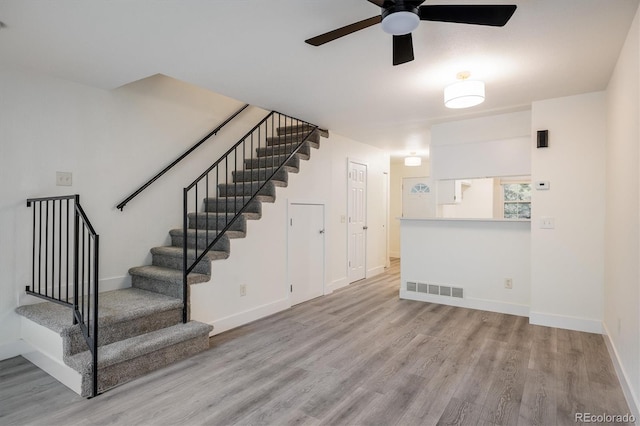 2933 W 81st Ave Unit F, Westminster, CO 80031 - stairway with wood finished floors and ceiling fan