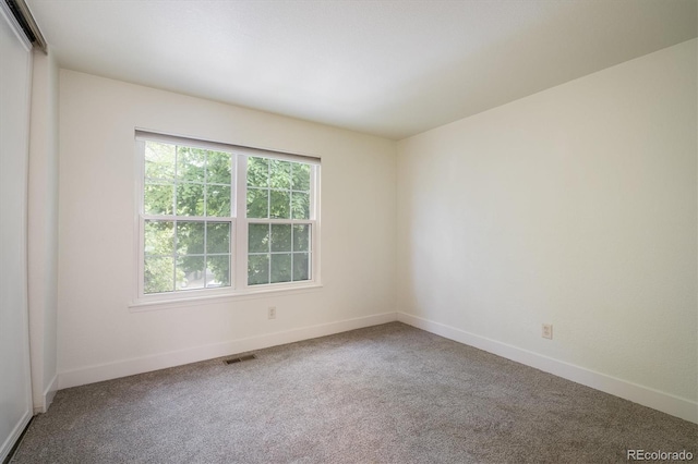 2933 W 81st Ave Unit F, Westminster, CO 80031 - spare room featuring carpet flooring and baseboards