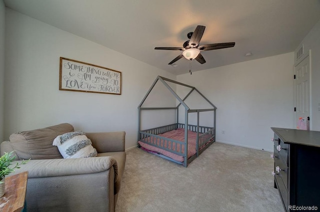 bedroom featuring visible vents, baseboards, light colored carpet, and ceiling fan