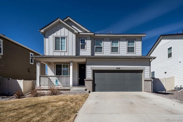 view of front of house featuring board and batten siding, fence, a porch, a garage, and driveway