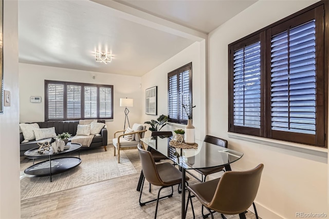 dining room featuring a healthy amount of sunlight and light wood-type flooring