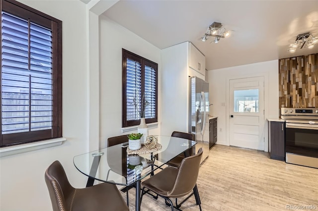 dining area with light hardwood / wood-style flooring