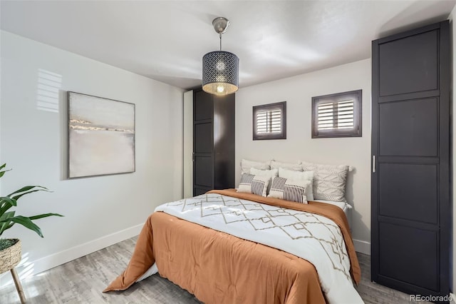 bedroom with light hardwood / wood-style floors