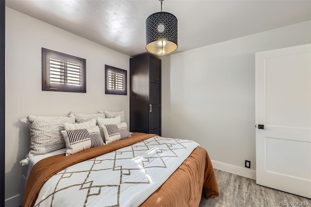 bedroom with light hardwood / wood-style floors