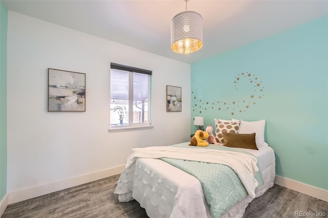 bedroom with wood-type flooring