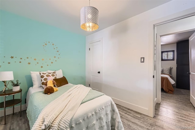 bedroom with wood-type flooring