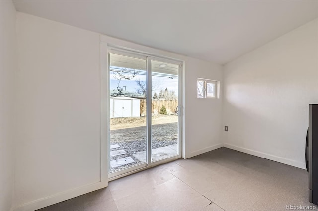 doorway to outside with lofted ceiling