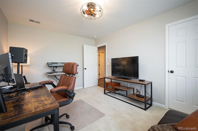 office space with light colored carpet, baseboards, and visible vents