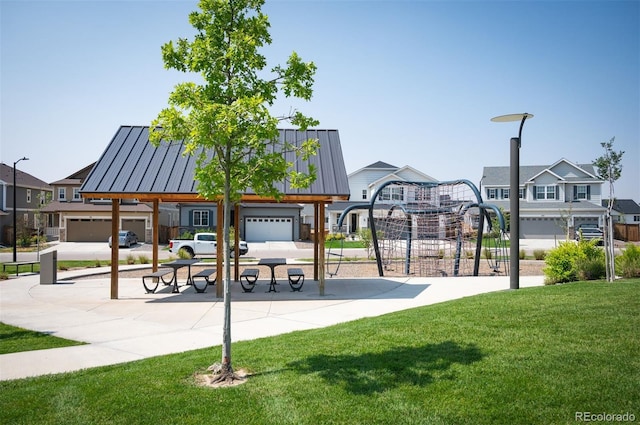 view of property's community featuring a residential view and a lawn