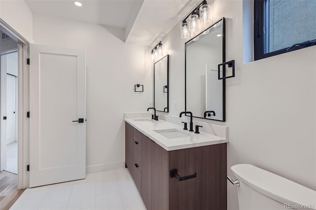 bathroom with toilet and vanity