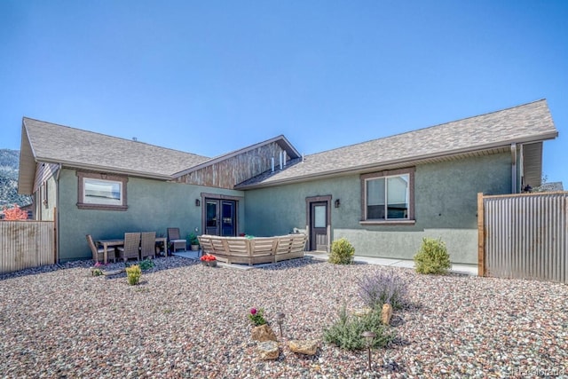 ranch-style home with a patio area and an outdoor living space