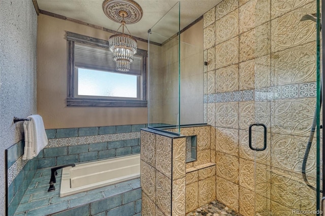 bathroom with separate shower and tub, a textured ceiling, and a notable chandelier