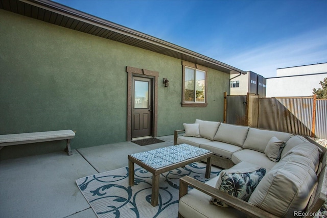 view of patio / terrace featuring fence and an outdoor hangout area