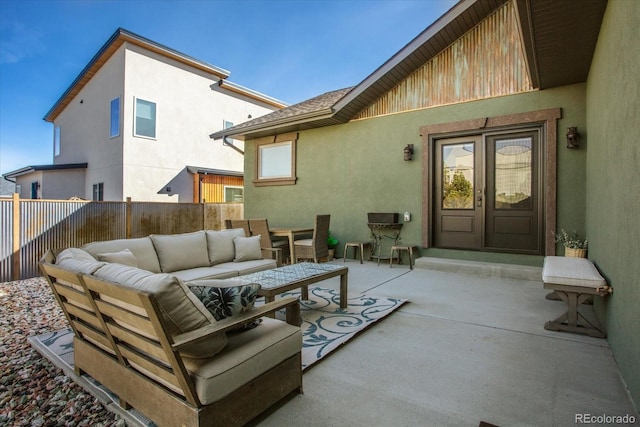 view of patio / terrace with fence and an outdoor living space