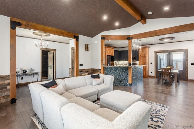 living room featuring a chandelier, recessed lighting, dark wood finished floors, and lofted ceiling with beams