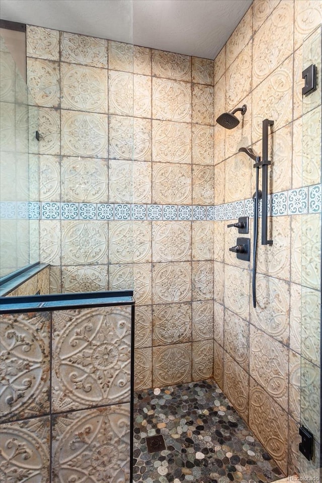 full bathroom with tiled shower