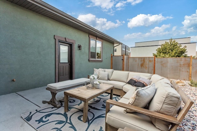 view of patio with fence and outdoor lounge area