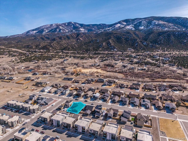 birds eye view of property with a residential view and a mountain view