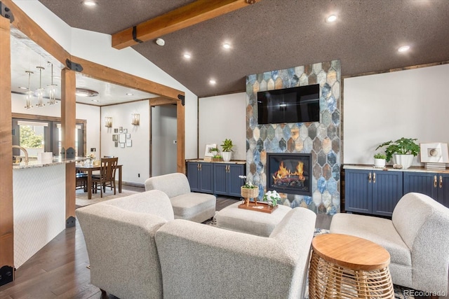 living area featuring dark wood-style flooring, a fireplace, baseboards, recessed lighting, and lofted ceiling with beams
